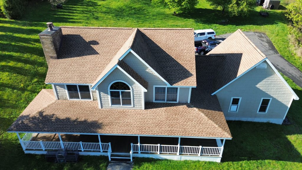 Aerial view of a house with new roofing and construction by RWB Roofing & Construction Inc.